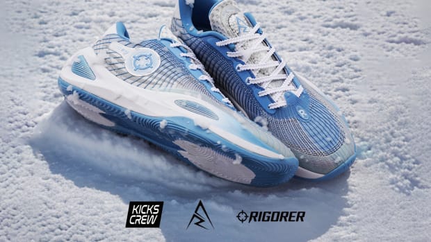 Side view of Austin Reaves' white and blue Rigorer sneakers.